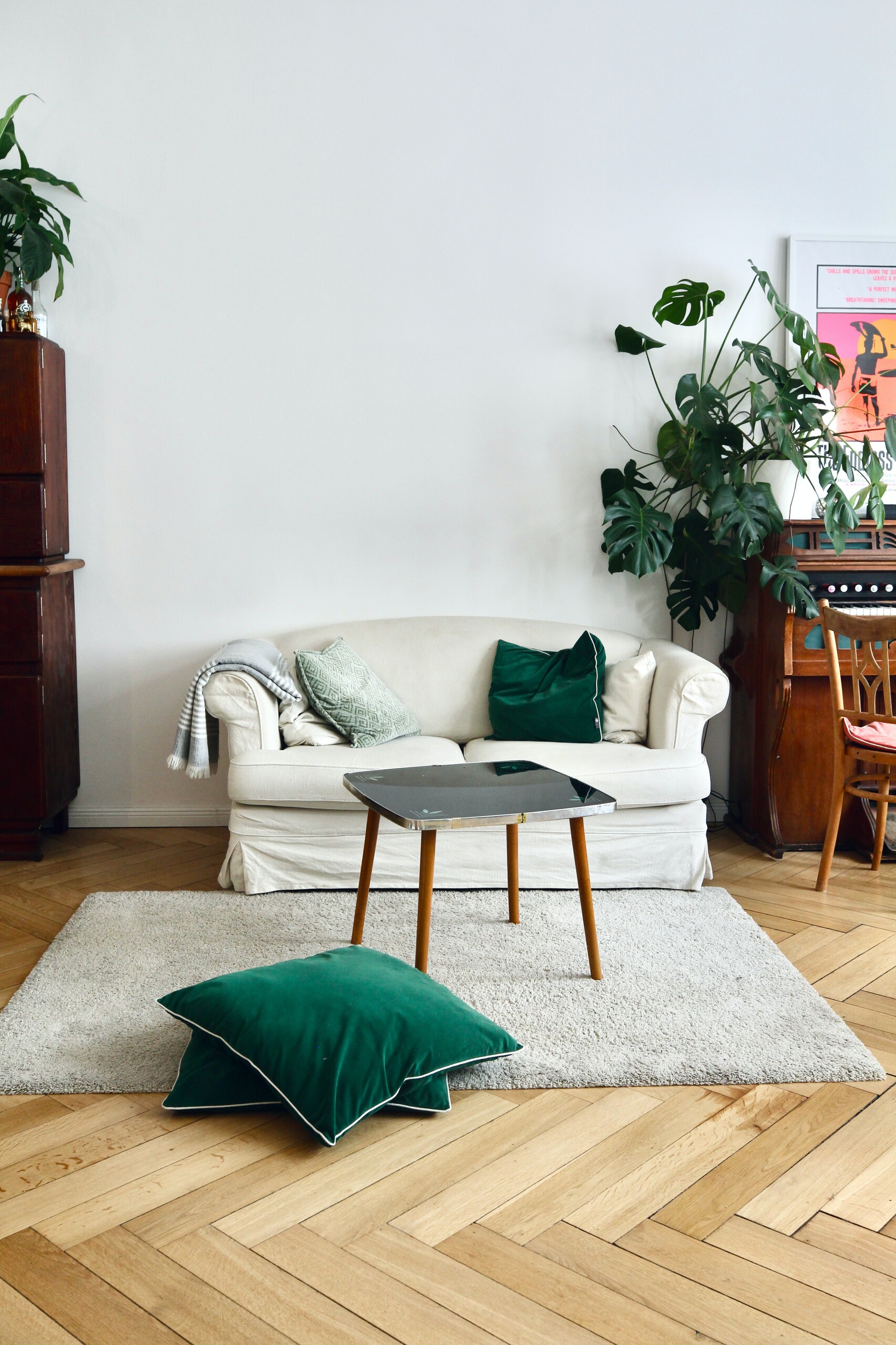 Green throw pillow on white sofa